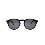 Óculos de sol redondos preto com lentes escuras, design moderno e elegante para uso diário.